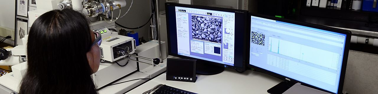 woman looking at her desktop in a laboratory