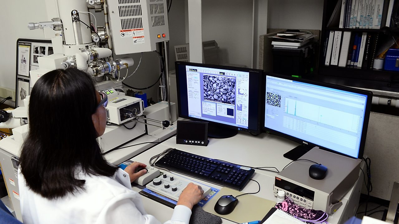 woman looking at her desktop in a laboratory
