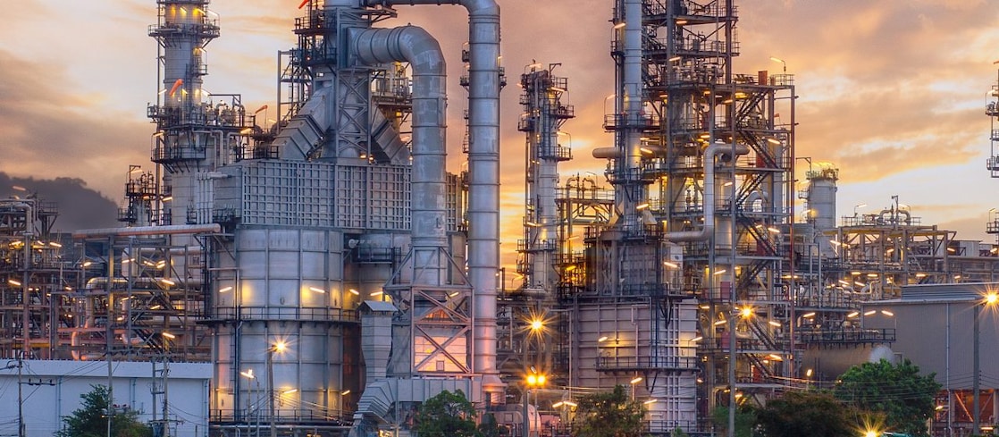 Arial view of a chemical manufacturing site in the gold haze of sunset